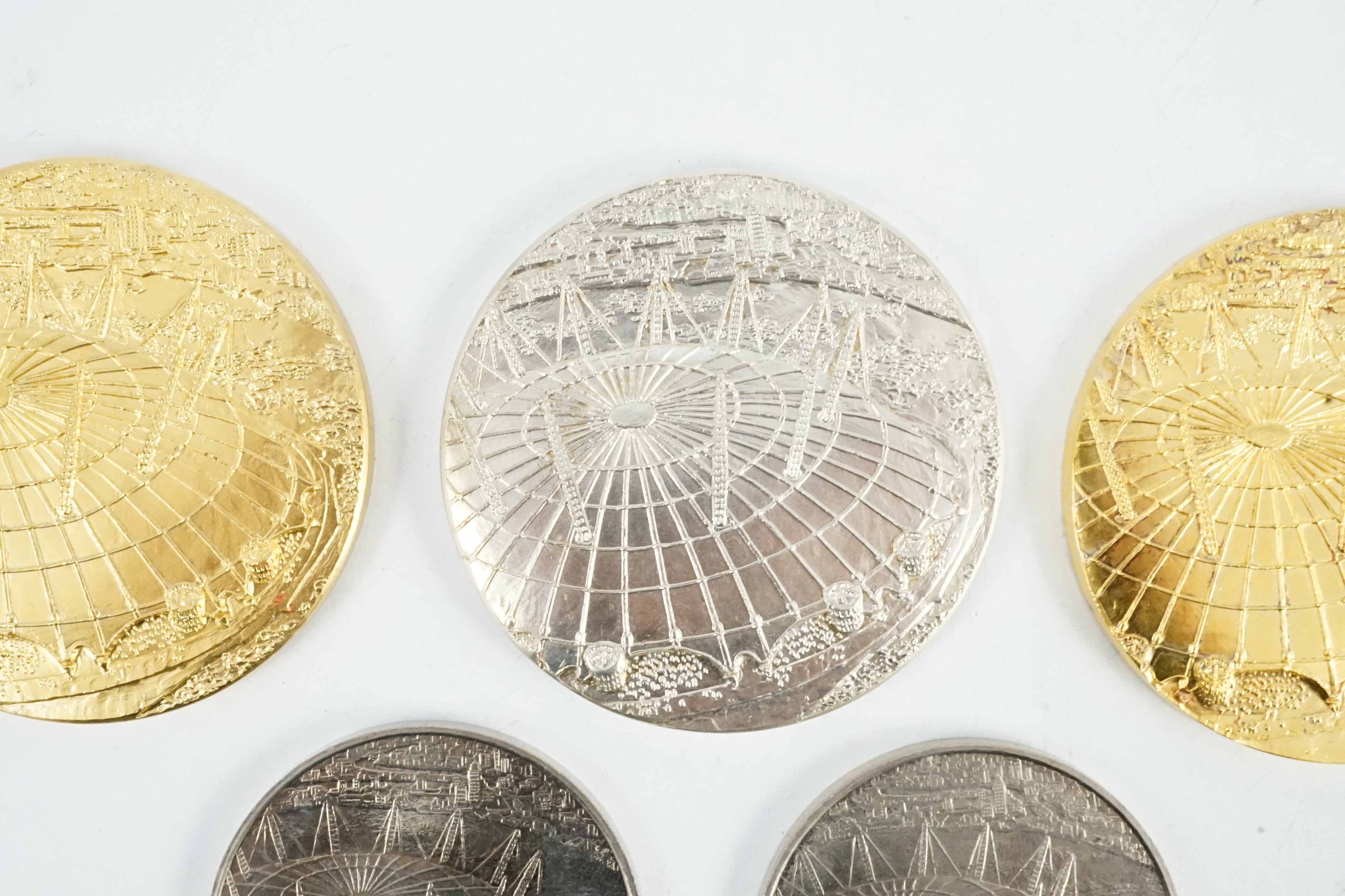 Jacqueline Stieger (b.1936) for Royal Mint, two prototype silver-gilt (Millennium) Dome medals, and a similar first strike silver medal